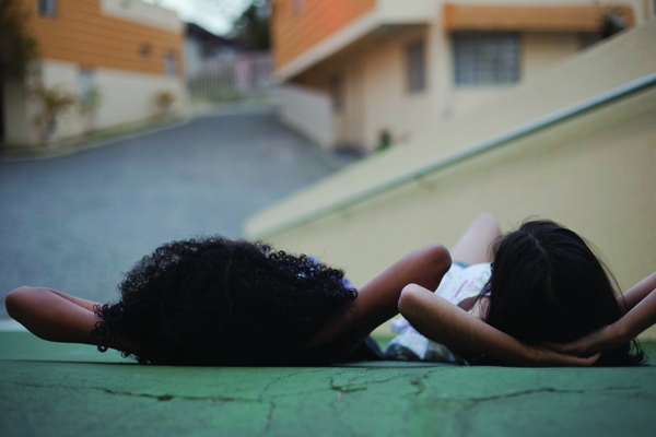 ‘V, age 11 and FB, age 14, lying down in front of the orphanage.’ - Michele Zambon - University of Westminster