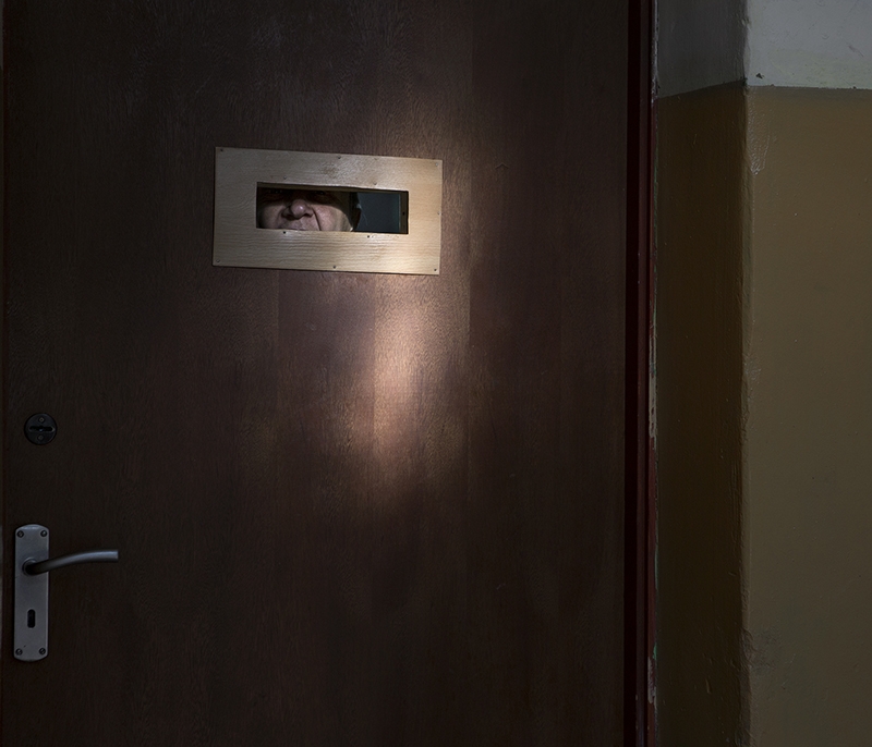 ‘Vision Panel Minsk District, Belarus 2015. Some of the older residents are locked in a small room without windows. The tiny vision panel in the door is all they have.’ - Jadwiga  Brontē  - London College of Communication